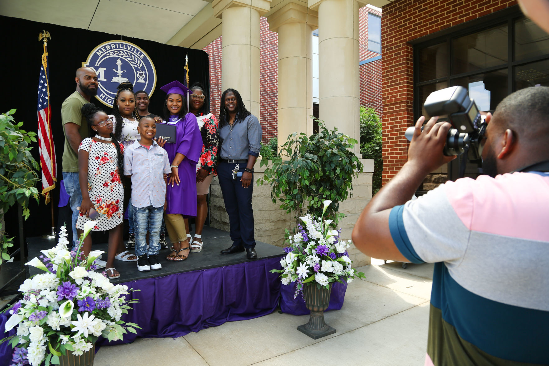 Merrillville High School seniors participate in a "drive-up" graduation